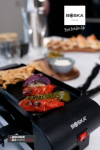 BOSKA Gourmet Raclette Mini set styled for a cosy winter evening, available for custom holiday branding from Bounce Creative Designs.
