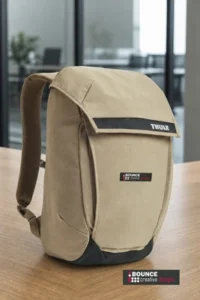 Close-up of the secure magnetic closure on the Thule Paramount Backpack 20L, featuring a 16-inch padded compartment within a premier business laptop backpack.